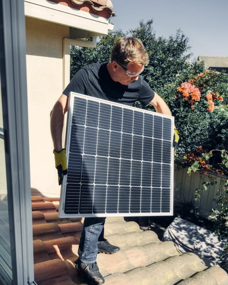 A worker installs a solar panel on a roof, promoting clean and renewable energy.